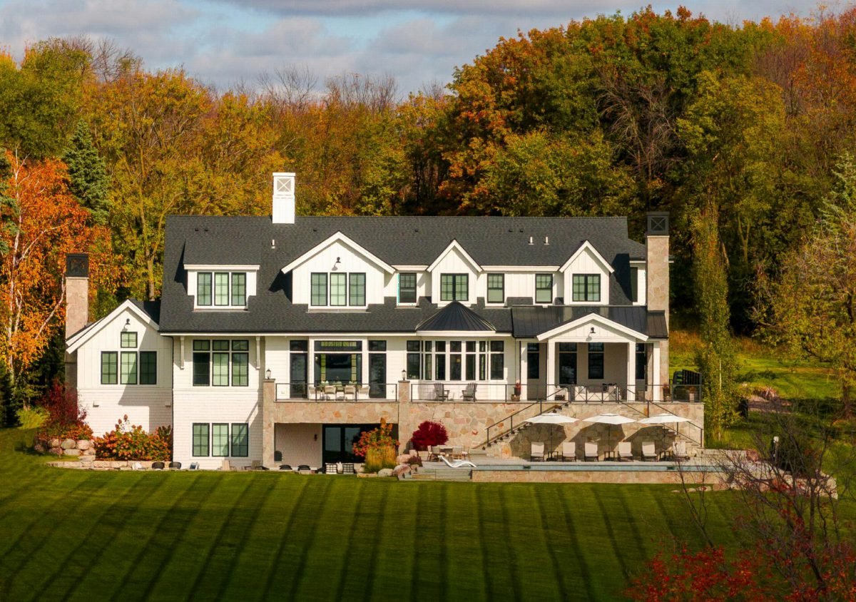 White Siding and Forest Foliage