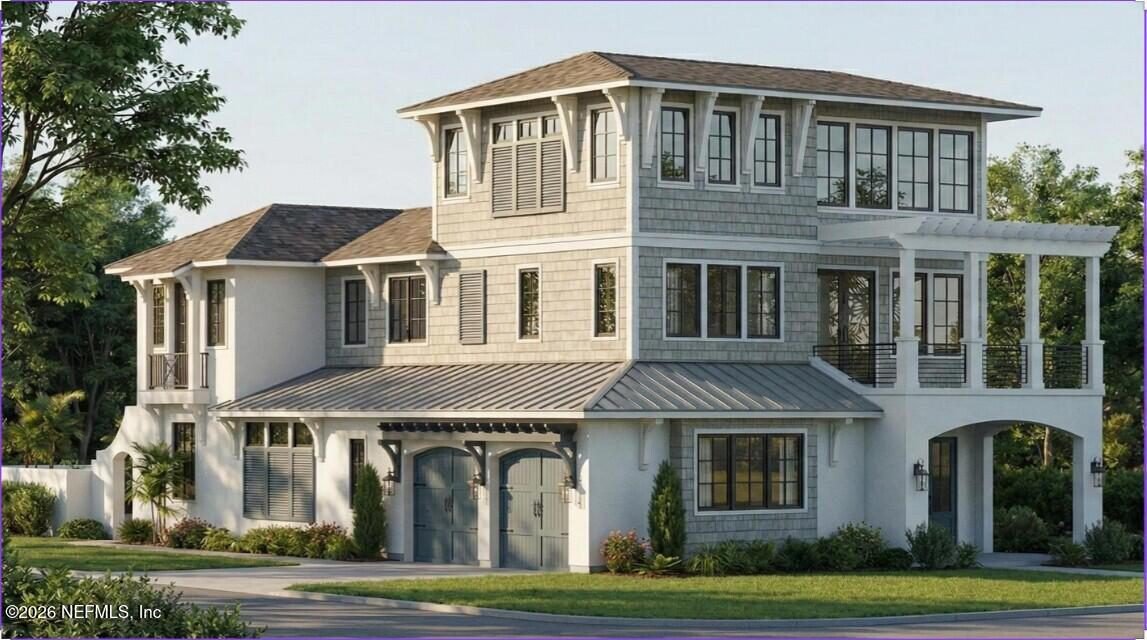Shingled Coastal Manor with Arched Entry