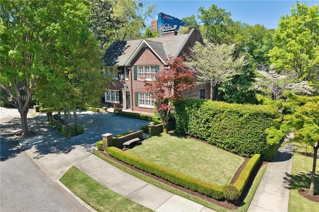 Brick Manor with Pruned Hedges