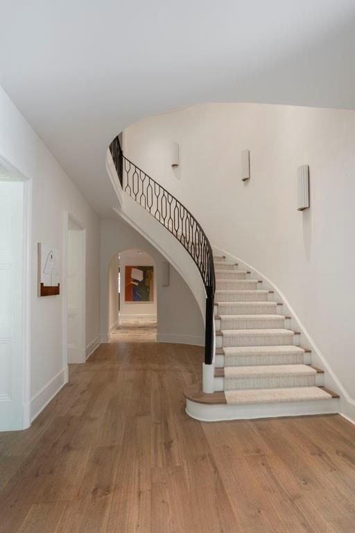 Sweeping Staircase with Woven Rail