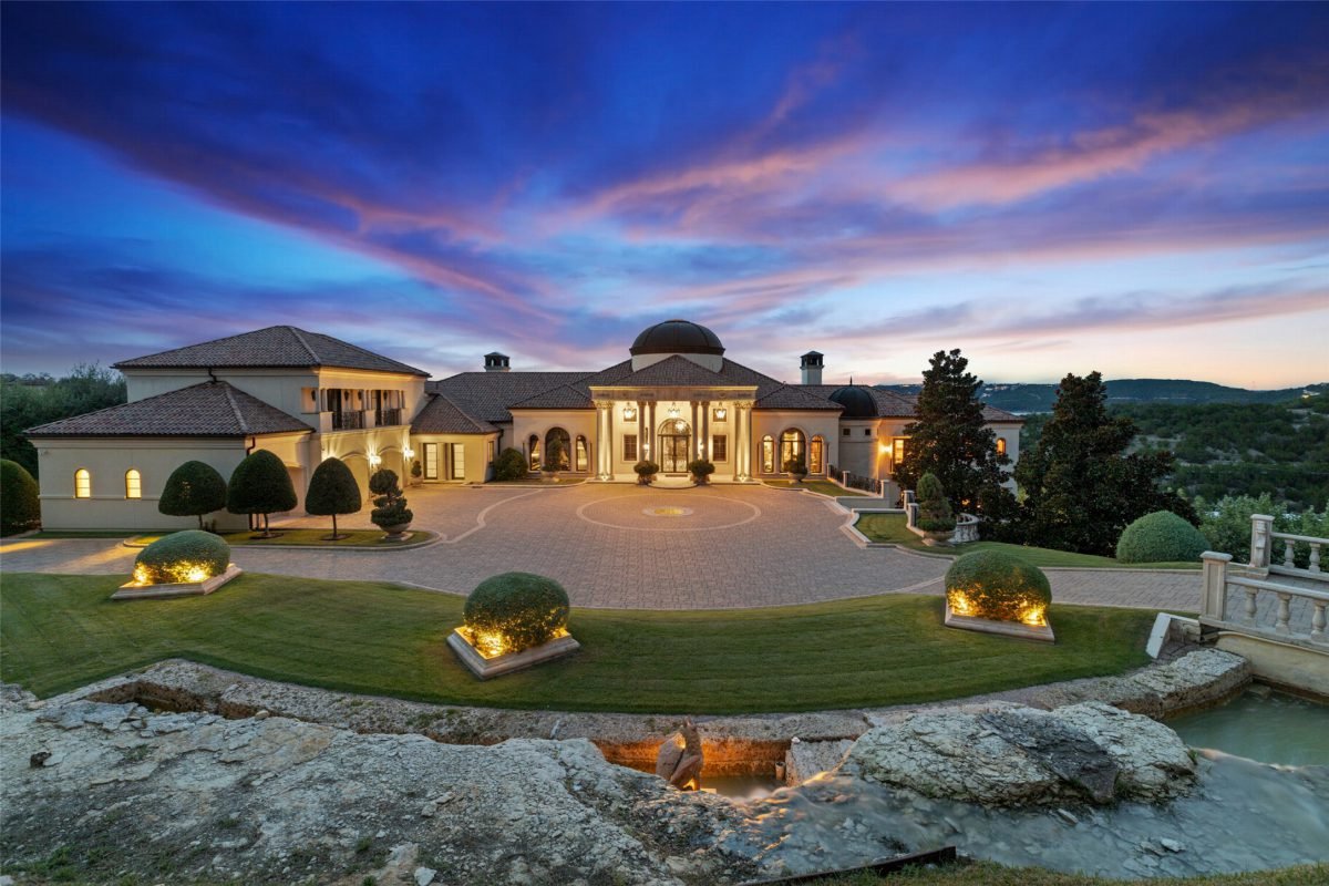 Dusk-Lit Estate with Stone Entry