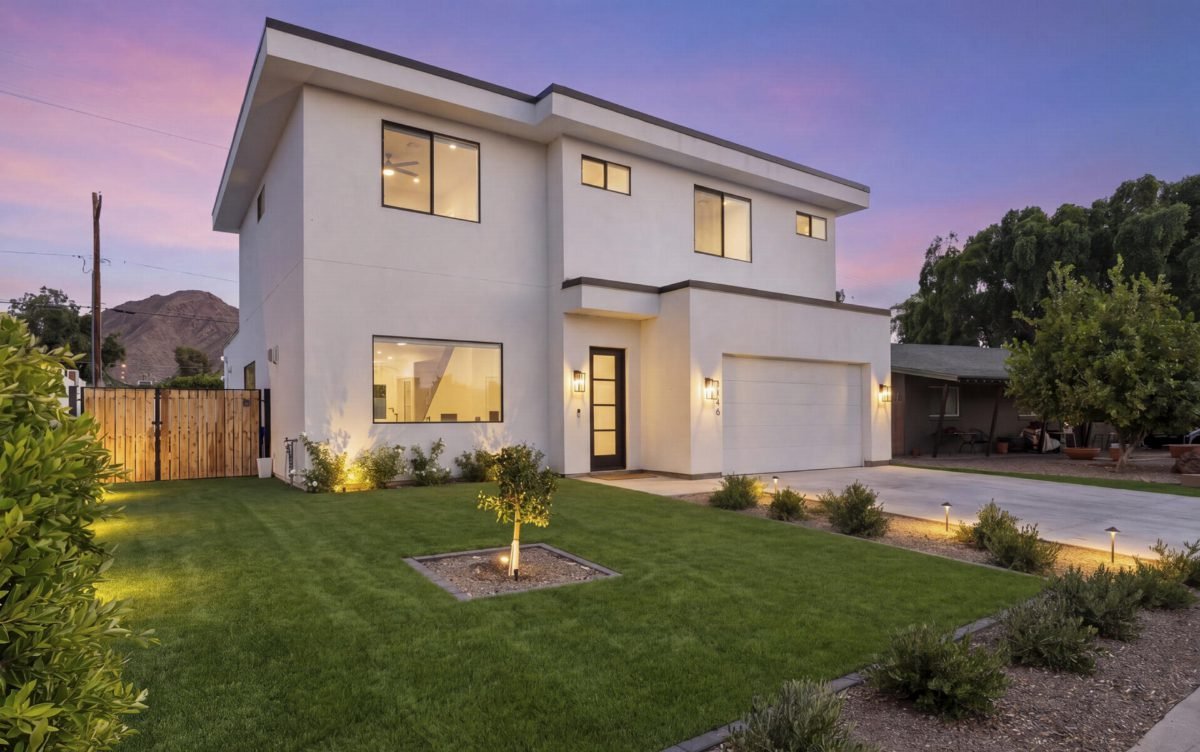 White Modern Facade with Emerald Lawn