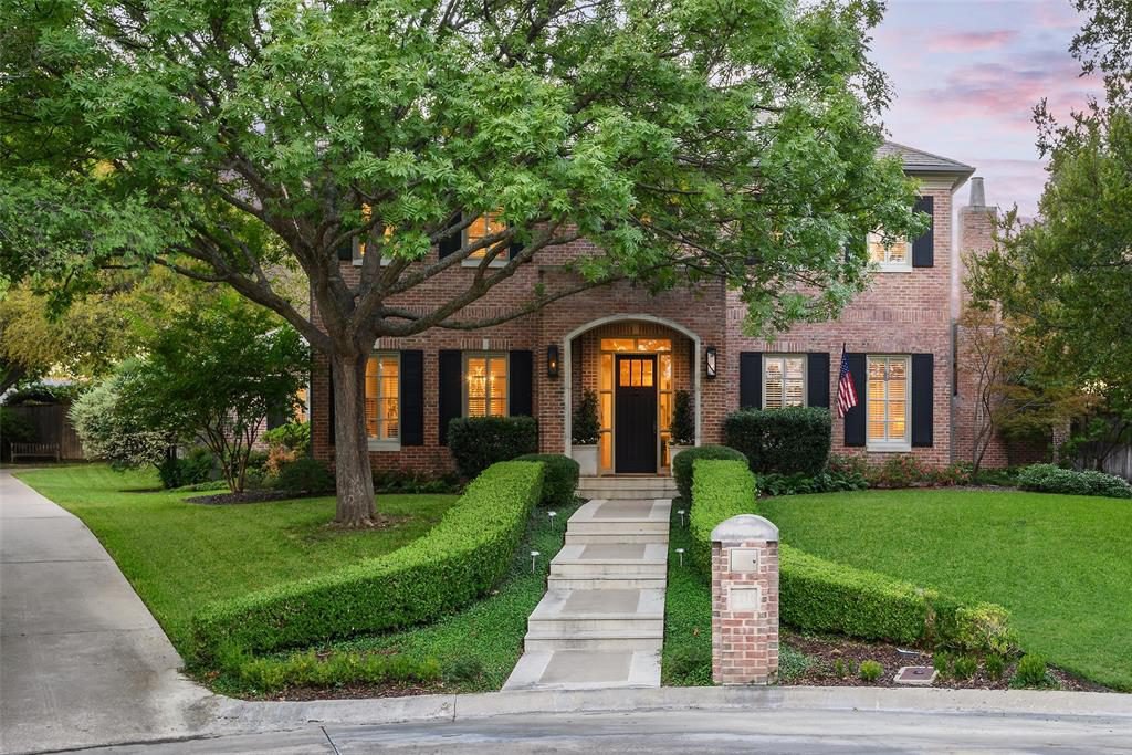 Arched Brick and Black Shutters