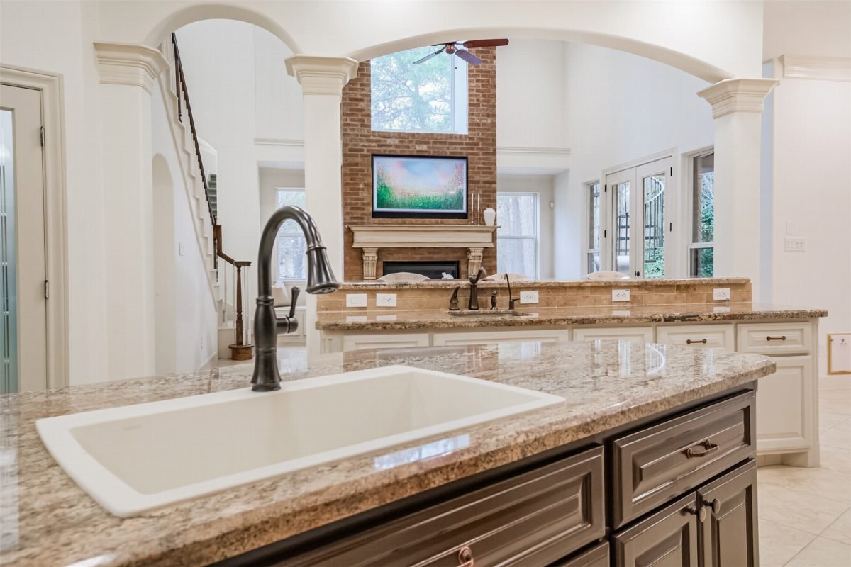 Warm Granite and Espresso Cabinetry