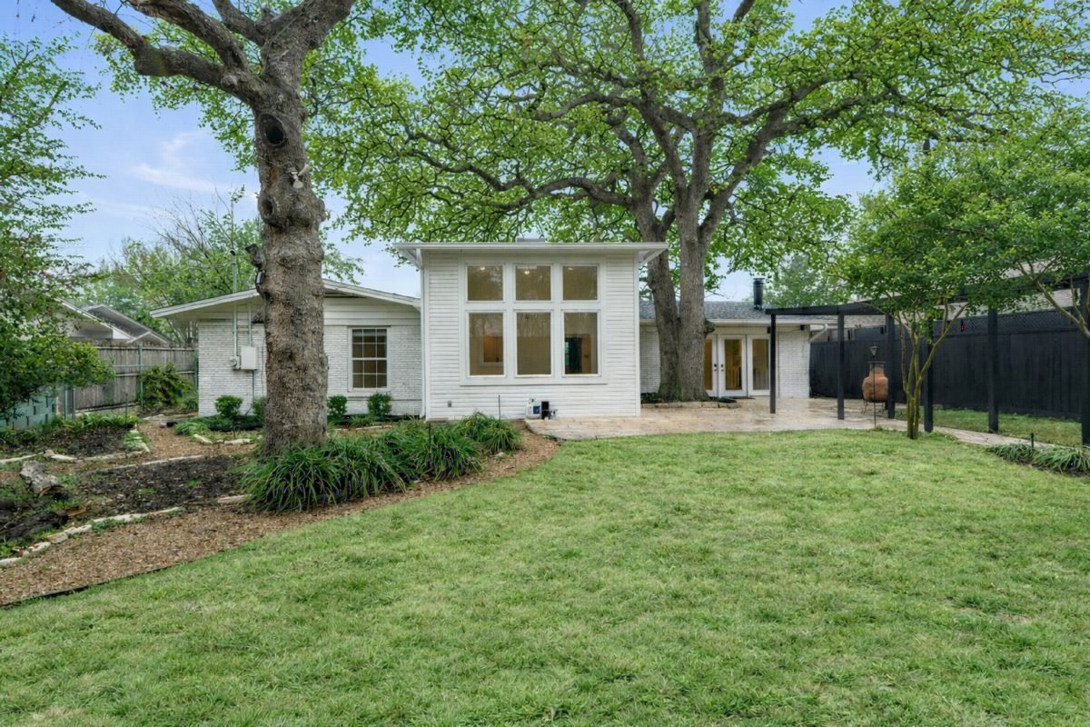 White Cottage Under Mature Oaks