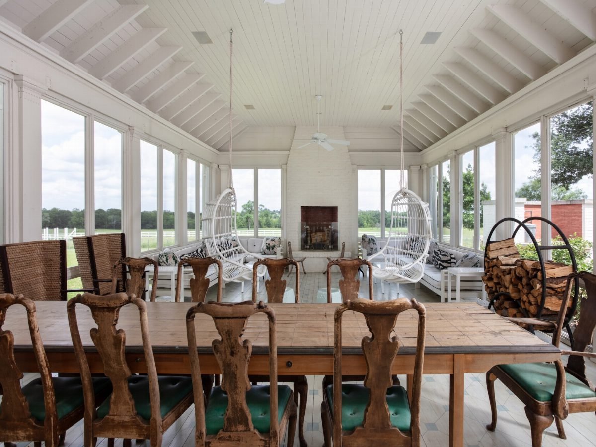 Whitewashed Sunroom with Rustic Wood