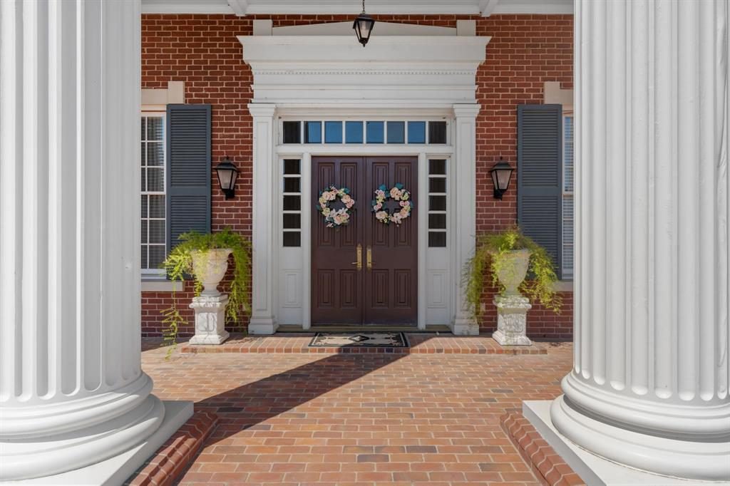Colonial Brick and White Columns