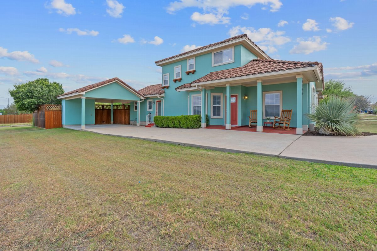 Seafoam Stucco and Terra Roof